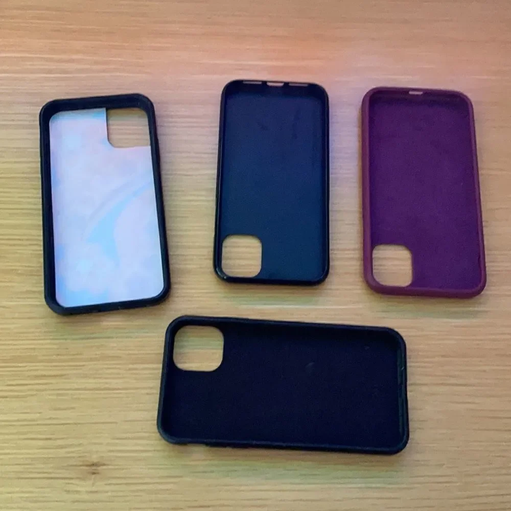 Various IPhone 11 cases including wallflower case